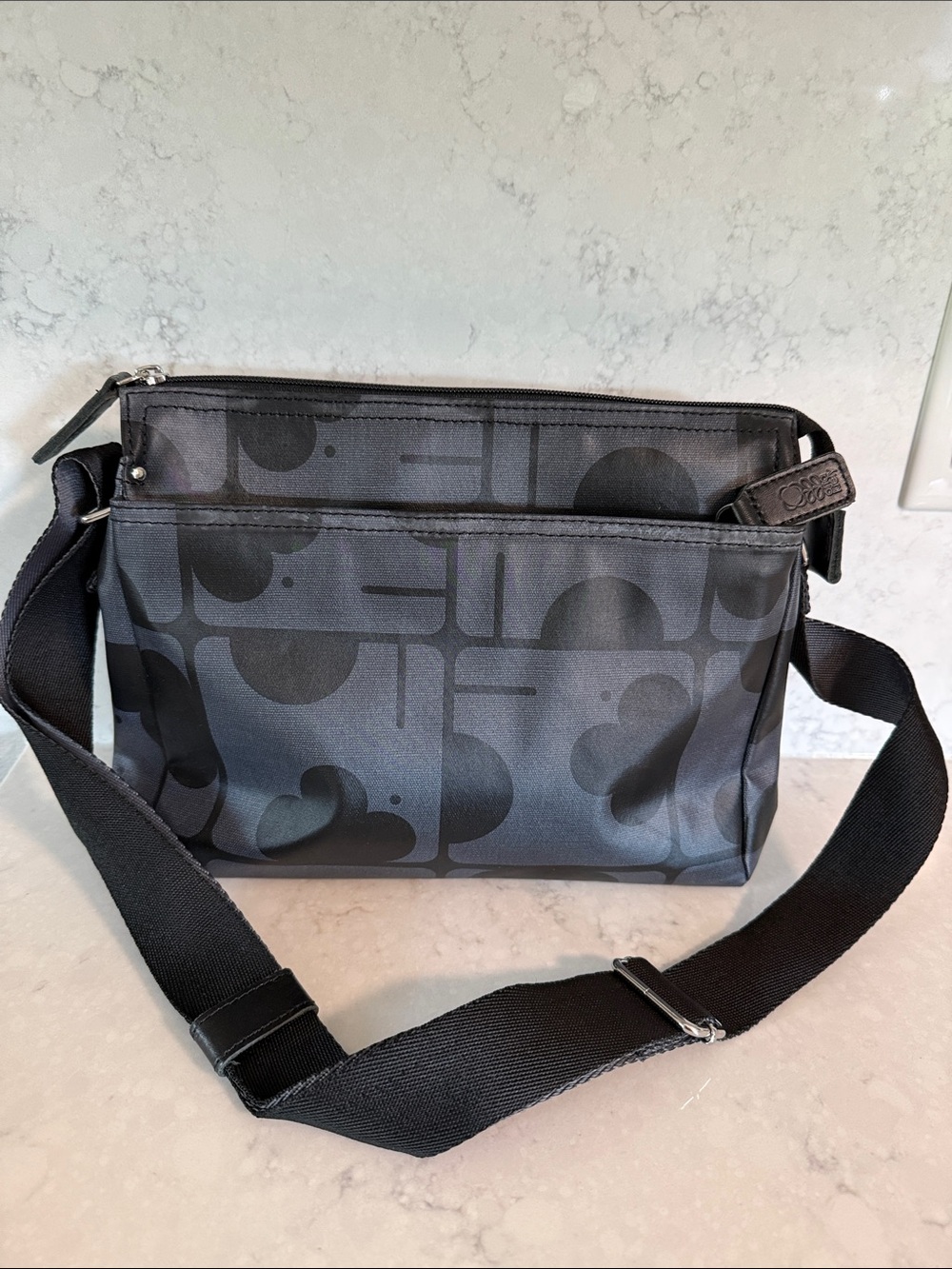Orla Kiely all gender coated canvas
crossbody messenger bag in dark blue/black